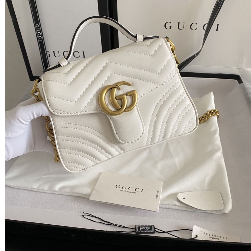 G*u*i top handle bags